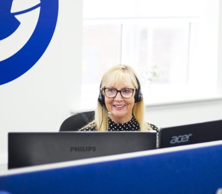 A telephone answering service PA taking a call